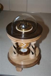 Ian Alstons winning piece<br>a sundial and a clock mounted in a colonnaded setting